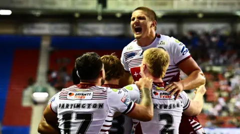 Wigan celebrate against St Helens