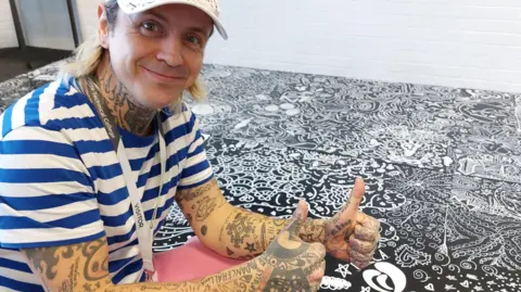 Dover District Council/Maison Dieu Graffiti artist Tim Smithen with his graffiti