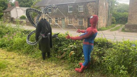 The Doctor Octopus and Spiderman scarecrows