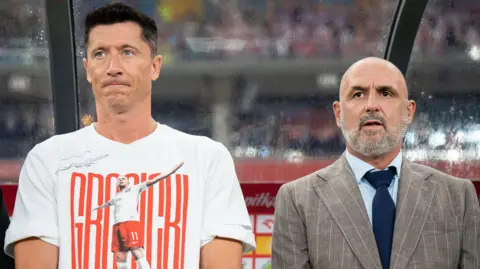 Robert Lewandowski next to Poland manager Michal Probierz at the friendly win against Moldova on Friday  
