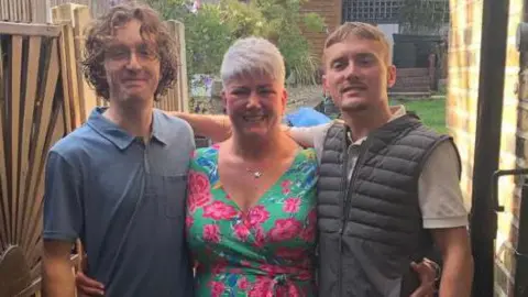 Emma Dawe-Costello (middle) and two sons Jack, 24 and Harry, 27