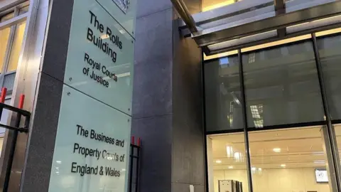 The Rolls Building at the Royal Courts of Justice in London which is a glass modern building 