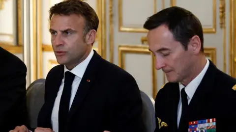 Macron (L) holds a defence council on France's Pacific territory of New Caledonia situation at Elysee Palace in Paris