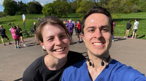 Ed Hutchison and his wife on a run, taking a selfie and smiling