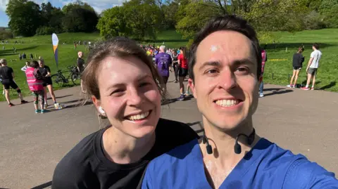 Ed Hutchison Ed Hutchison and his wife on a run, taking a selfie and smiling