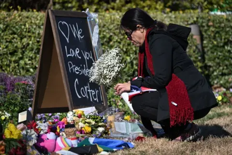 Mourner outside Carter Center