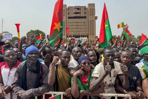 AFP Hundreds of people gather at Place de la Nation Ouagadougou waving flags and showing their support for Capt Ibrahim Traoré.