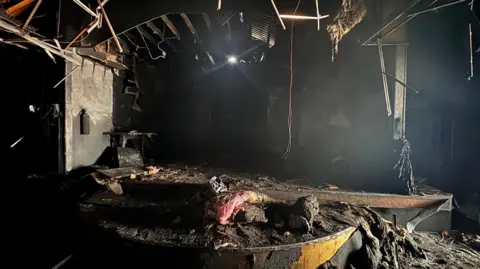 Louise Edge Image shows the destroyed, blackened stage area in the dance school