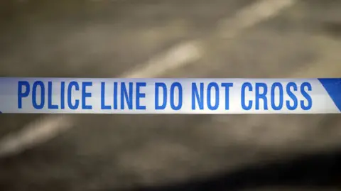 A blue and white police tape