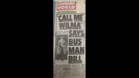 Brian Gilmore A front page news story from the Sunday World in 1977 reading "Call me Wilma, says bus man bill". 