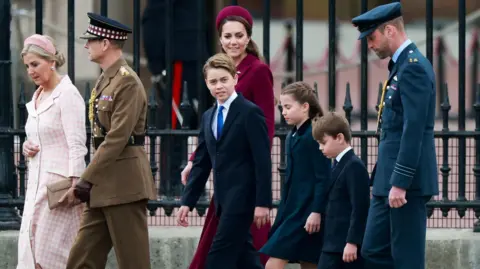 Reuters The Prince and Princess of Wales arrive at the commemorations with their three children