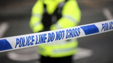 BBC a generic admission of a police cord with an officer in a high vis