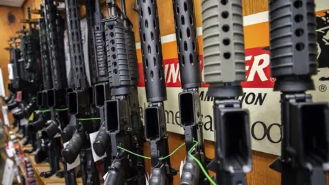 Getty Images Guns lined up on a wall