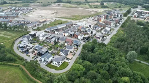 An aerial shot of Graven Hill taken in 2022 shows lots of houses that all have different designs.