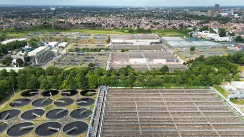 A drone view shows Mogden Sewage Treatment Works, operated by Thames Water, which processes sewage water from over two million people