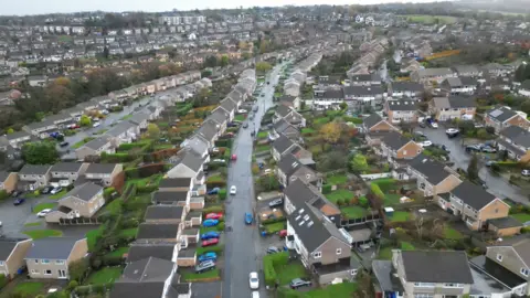 A drone picture showing houses on a street in Sheffield