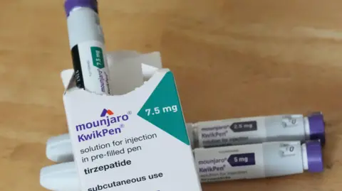 Stock image of Mounjaro boxes and jabs.