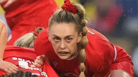 Hannah Jones protects possession at a Wales ruck