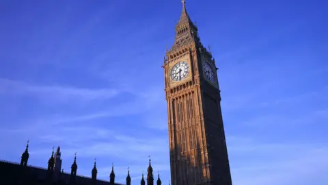 PA Media General view of Big Ben, with a blue sky behind
