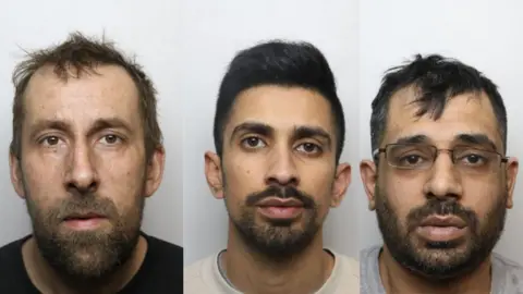 West Yorkshire Police Police mugshots of three men. On the left is a man with a long oblong face, ruffled hair and a beard. In the middle is a youngish-looking man with a beard and quiffed black hair. On the right is a middle-aged man with a beard, untidy hair and glasses askew.