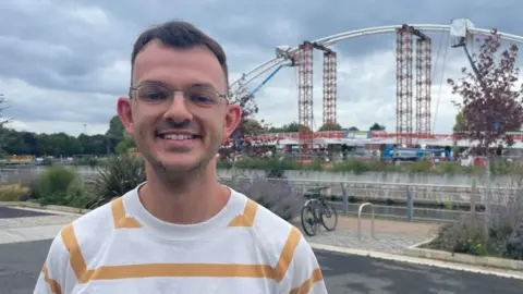 BBC Rhys Callow stood in Trent Basin, with the Waterside Bridge in the background.