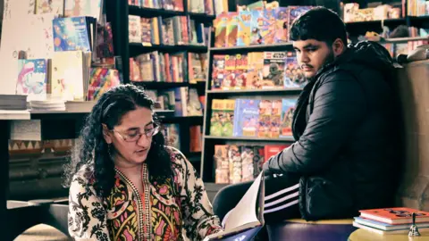 Cath Muldowney Organiser Mussarat Rahman reading at one of last year's event