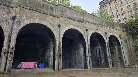 Tents underneath arches in Bradford