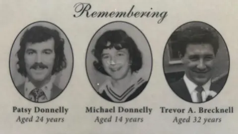 Family handout A photo of a memorial card remembering three men. Patsy Donnelly, 24, Michael Donnelly, 14, and Trevor Brecknell, 32. 