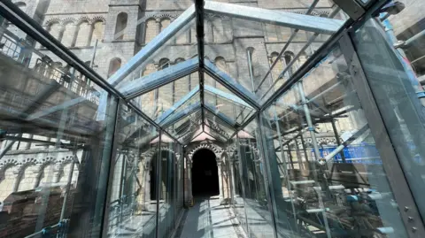 Looking down a glass atrium to the side of Norwich Castle