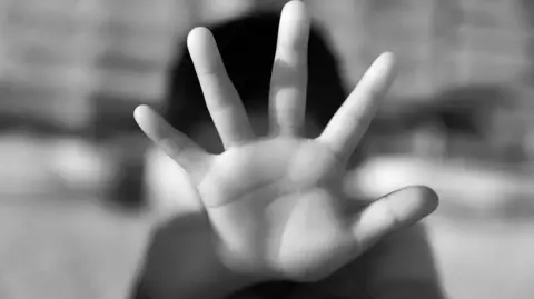Close-up of a child showing stop gesture - stock photo