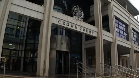 BBC Exterior shot of Kingston Crown Court, a white concrete building