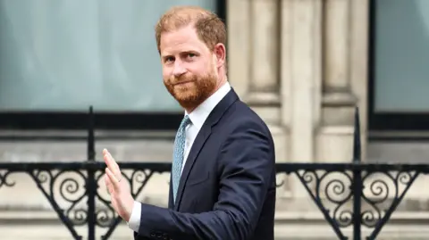 Prince Harry, Duke of Sussex waves as he leaves the High Court, in central London, on April 8, 2025 after an hearing about a government decision to downgrade his personal security during visits in Britain. 