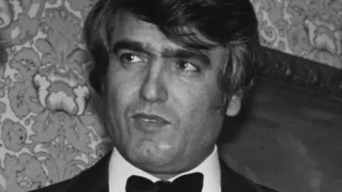 B. Gomer/Express/Hulton Archive/Getty Images Black and white headshot of Ahmed Obaidly, a United Arab Emirates diplomat and associate of Al Fayed