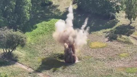 Norfolk Constabulary An aerial view of a large explosion in a green field