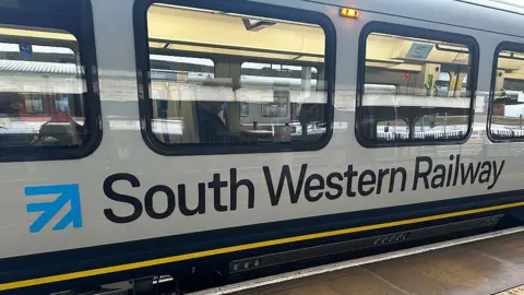 Getty Images A photo illustration of a white South Western Railway train.