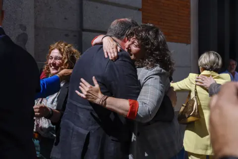 EPA Pro-Catalan independence MPs hug each other celebrating the passing of an amnesty law