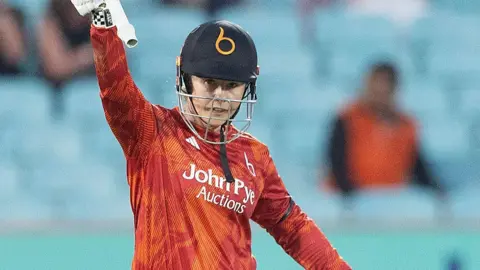 Tammy Beaumont acknowledges the applause after scoring her 50 for The Blaze