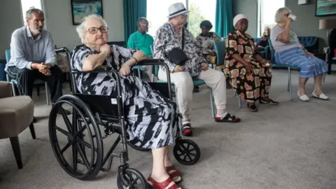 Getty Images People taking part in a gentle exercise session at a residential care home (file pic)