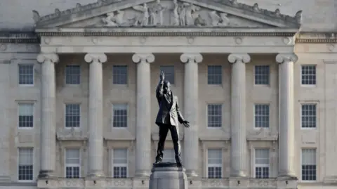 PA A general view of Stormont Parliament in Belfast, Northern Ireland. In the foreground is a statue of Lord Carson 