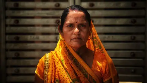 Seraj Ali Parmi Devi at the gater of her house in Shahjahanpur village in Bundelkhand