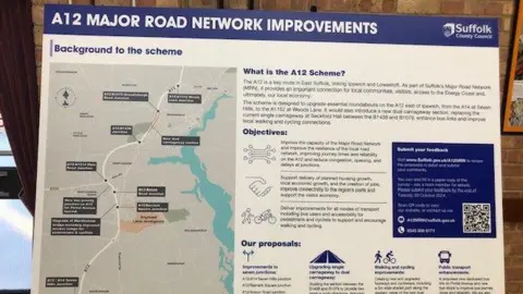 Vikki Irwin/BBC A picture of a noticeboard that shows the A12 improvement plan in full. A map of the plans can be seen along with information about what the scheme is, the objectives and the proposal.