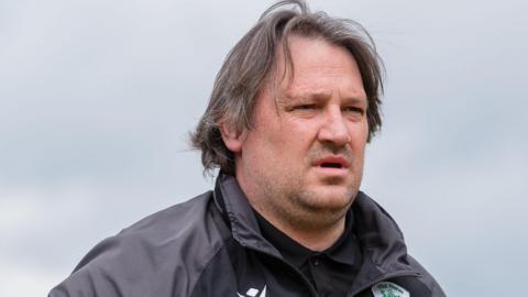 Craig Harrison looks on from the touchline