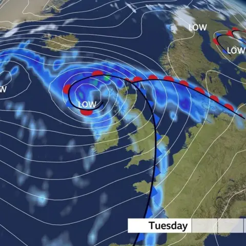A BBC weather map showing isobars, low pressure, blue areas of heavy rain and the word "Tuesday" in black letters on a white background.