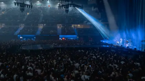 Sophie Scott Thousands of people watching a concert in Madrid