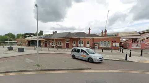 Google The exterior of Stratford-upon-Avon railway station, as taken from across the road. A silver taxi is visible outside.