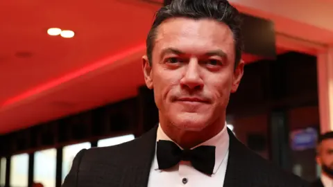 Luke Evans in a tux