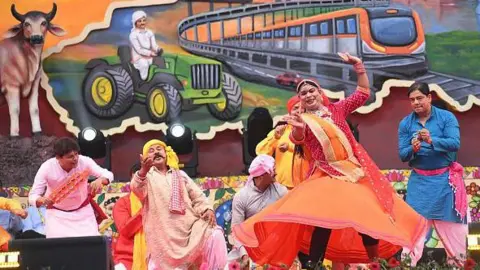Getty Images Folk artists performing during Bihar Diwas 2026 function at Gandhi Maidan on March 22, 2026 in Patna, India.