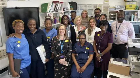 The virtual ward team at Medway Maritime Hospital gathered in their office