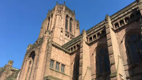 An external view of Liverpool Cathedral, which has light brown sandy-coloured masonry