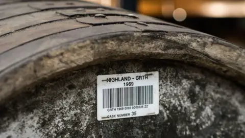 Mark Littler LTD A close-up shot of a barrel of whisky. 